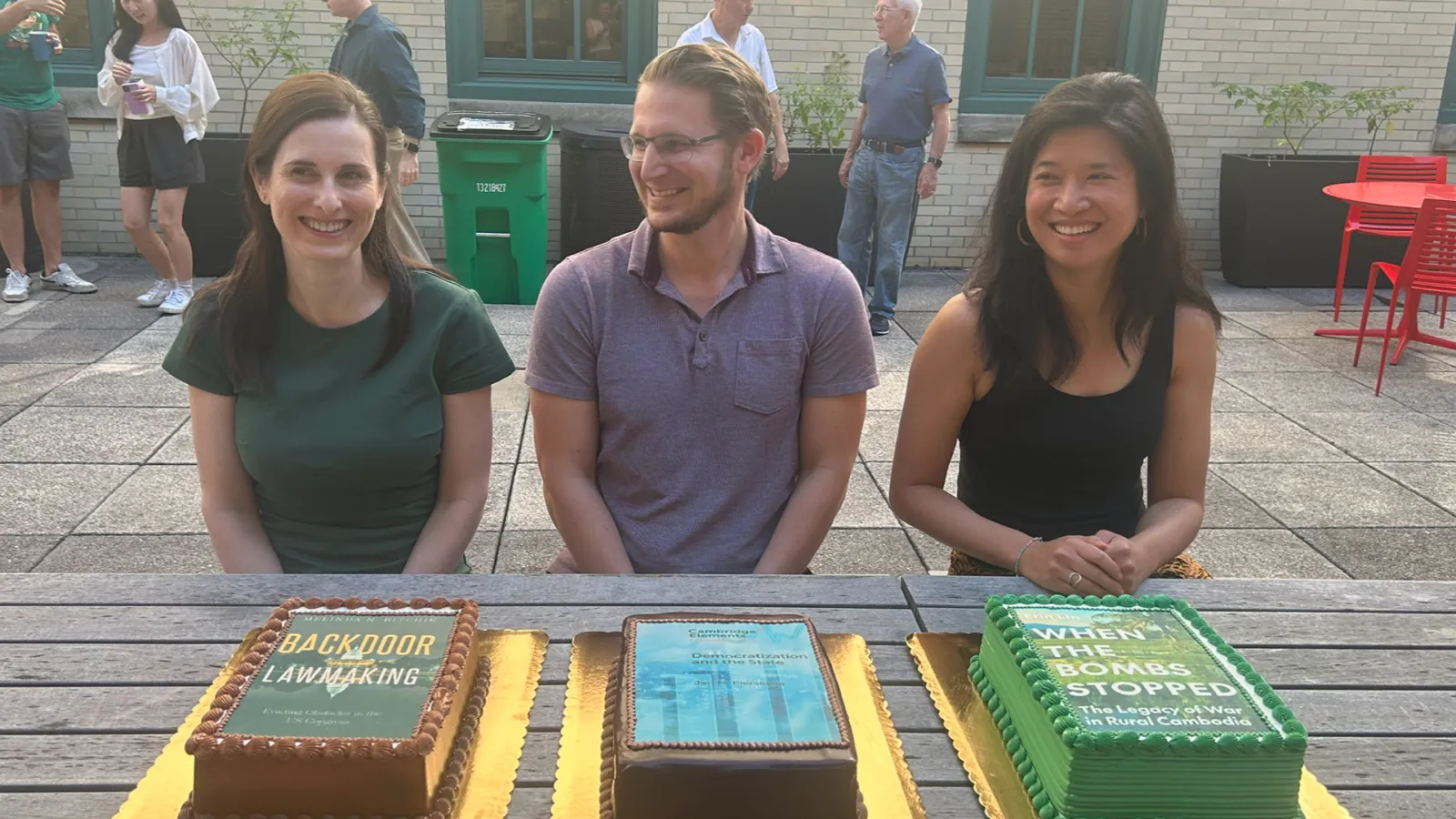 Book Authors in Front of their Respective Cakes