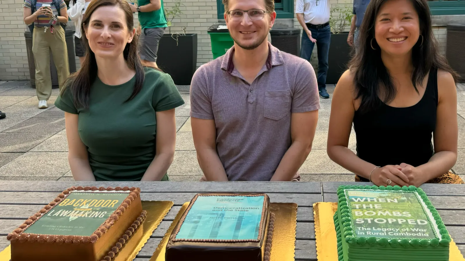Book Authors in Front of their Respective Cakes