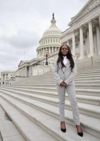 Suzan Mchao headshot in front of the capital washington dc 