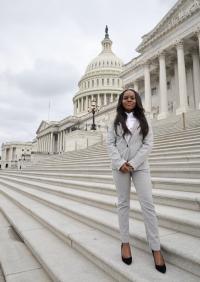 Suzan Mchao headshot in front of the capital washington dc